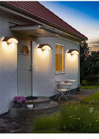 Black Curved Outdoor Wall Light - Minimalist LED Sconce with Soft Warm Glow for Modern Homes