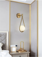 Minimalist Brass Teardrop Wall Lamp with Frosted Glass Shade